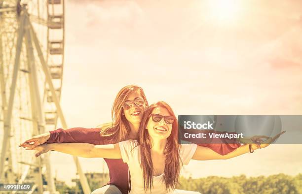 Best Friends Enjoying Time Together Outdoors At Ferris Wheel Stock Photo - Download Image Now