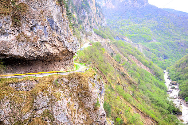 The narrow dangerous road on the steep slope of rocks in Cherek gorge