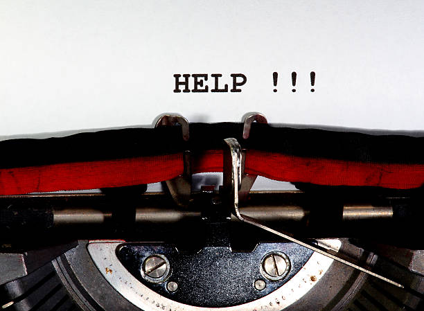 istock help written with black ink with the typewriter 499913330