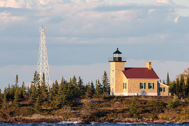 istock Brick Lighthouse with Red Roof in Warm Light 499913430
