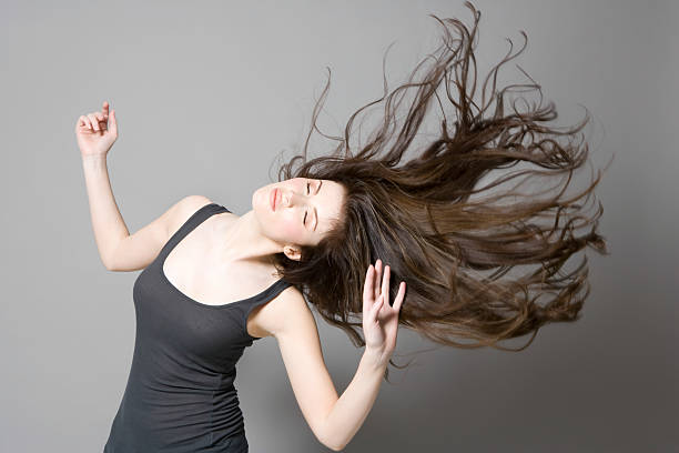 istock Woman With Long Brown Hair Dancing 499914315