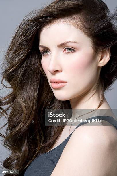 Woman With Long Brown Wavy Hair Stock Photo - Download Image Now - Adult, Beautiful People, Beauty