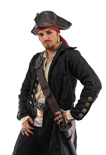 Photo of a male pirate posing with a hand on his hip and wearing an intricately detailed black coat.