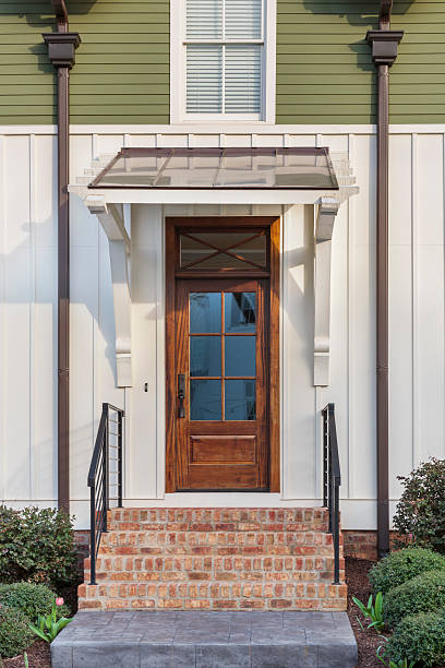 istock Wooden home front door on sunny day 499914821