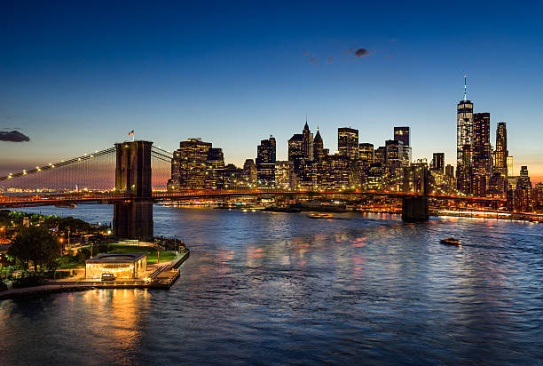 istock Brooklyn Bridge and illuminated Manhattan skyscrapers at Twilight. New York 499921936