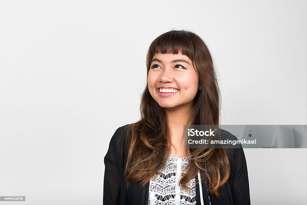 Portrait of Asian woman smiling Horizontal studio shot of Asian woman smiling Women Stock Photo