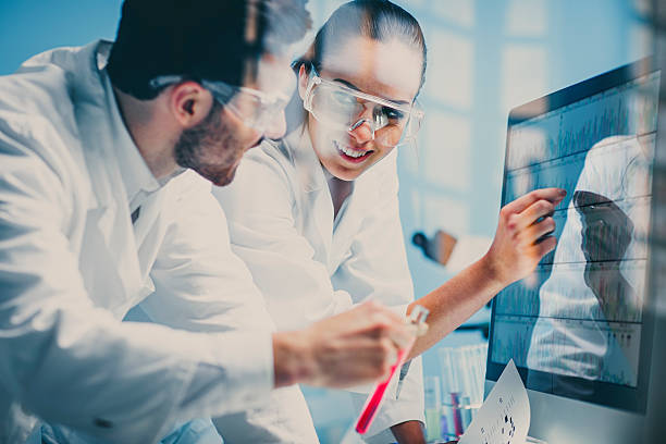 istock scientists looking at a DNA sequence on the monitor 499927392