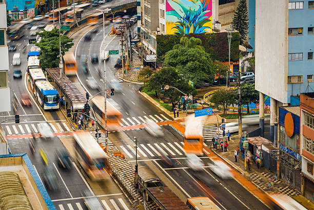 Entering in the bus Intense traffic in the Consolacao avenue, Sao Paulo, Brazil. It shows the dynamics of the traffic in that busy spot. personal land vehicle stock pictures, royalty-free photos & images