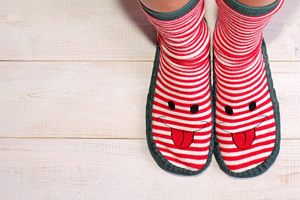 istock Womant wearing funny socks with with happy smiley face. 499927674
