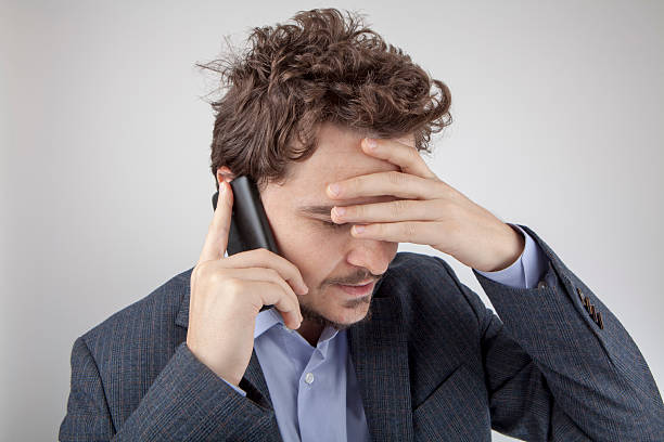 istock Tensed businessman having conversation on the cellphone 499927682