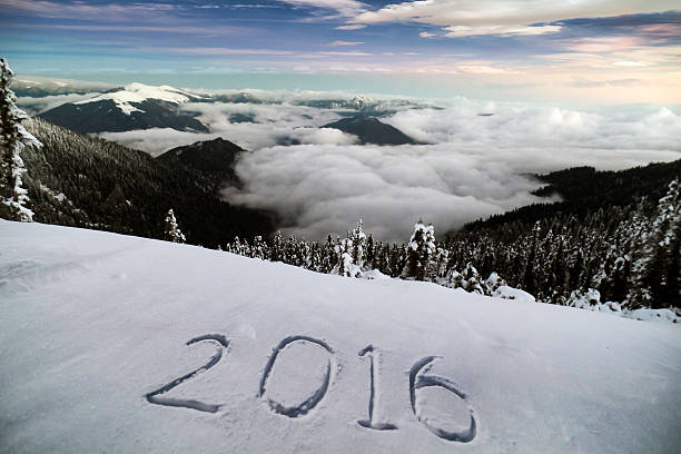 New year 2016 on snow at mountains
