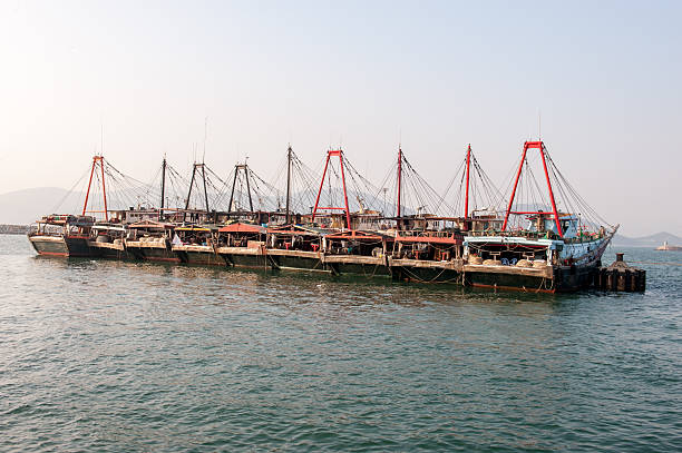Row of fishing boats stock photo
