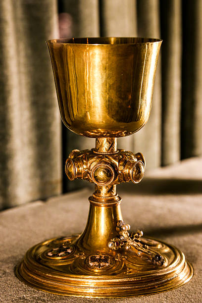 istock Golden holy chalice on gray background 499932412