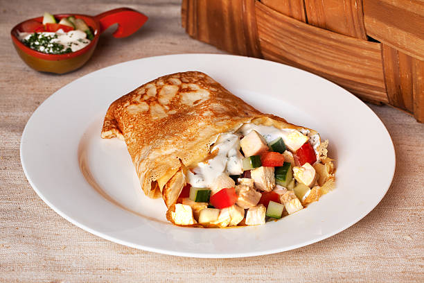 pancake with chicken, tomatoes, peppers, cucumbers rural rustic stock photo