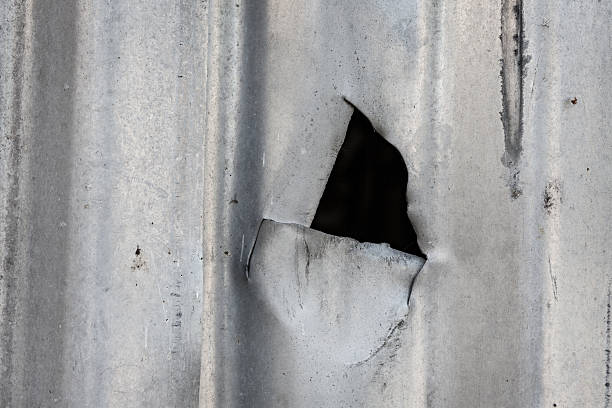 istock Cut in corrugated metal sheet 499935018