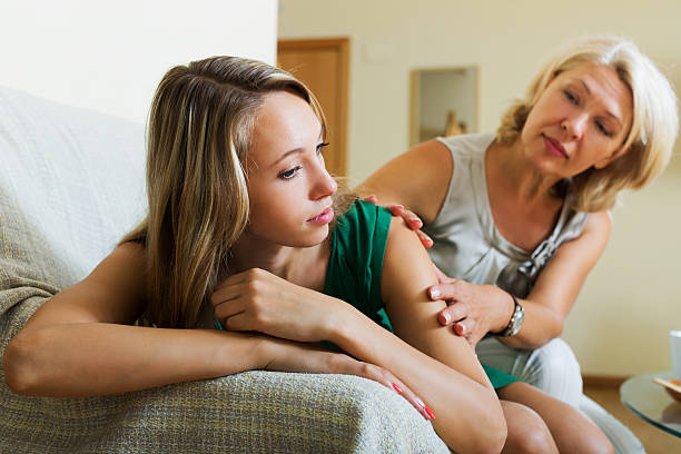 istock Mother comforting crying daughter 499935302