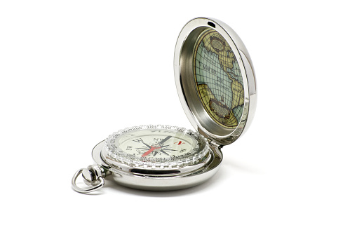 Silver open isolated compass with map over white