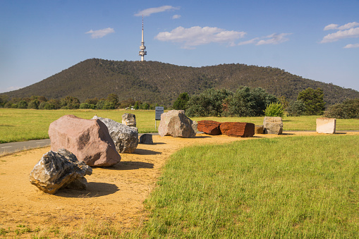National Rock Garden, a collection of rocks on public display at a park in Canberra, Australia. Black Mountain Tower visible in the background.