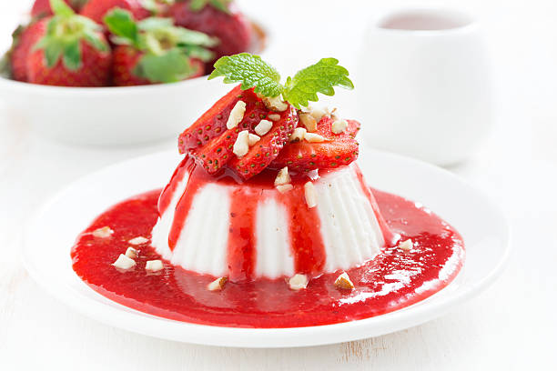 istock Vanilla panna cotta with strawberry sauce on a plate 499980599