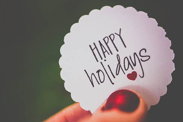 istock Handmade Happy Holidays message against defocused Christmas tree 499981840