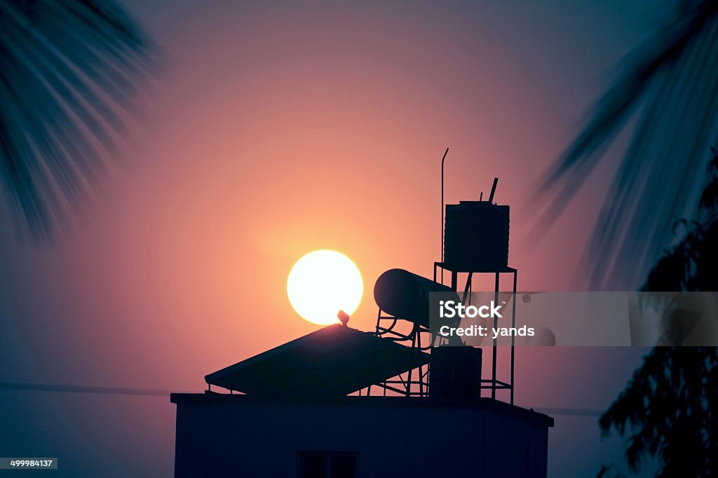 sun with water heater solar panel Boiler Stock Photo