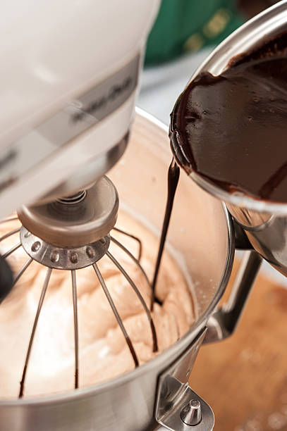 istock Mix flour, eggs, sugar and hot chocolate in mixxing machine 499985255