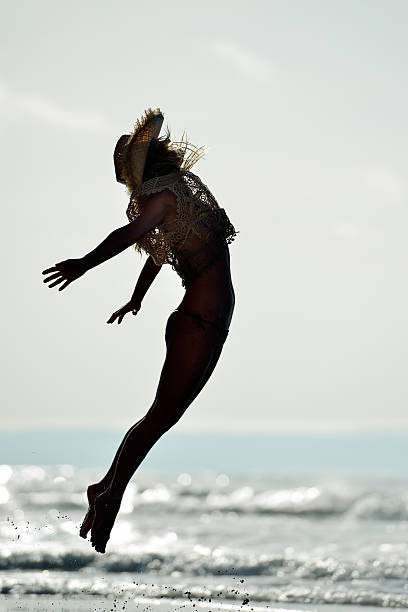 istock young woman on the beach in summer 499985317