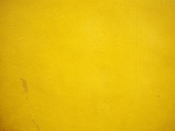 Old yellow cement wall background stock photo