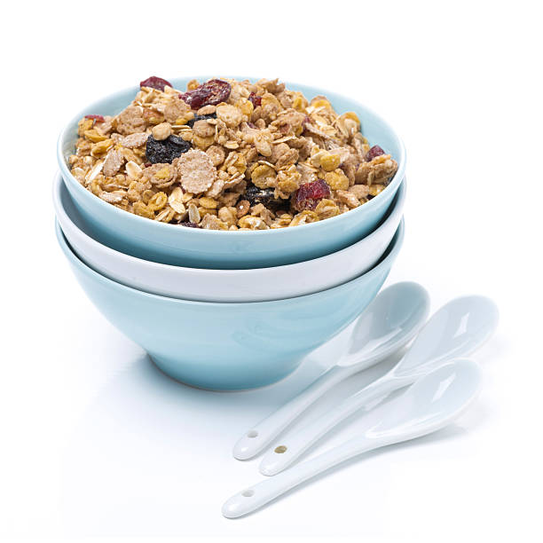 istock homemade granola in a bowl and spoons, isolated 499998033