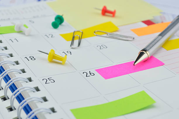 istock Pencil with sticky notes and pin on business diary page 499999838