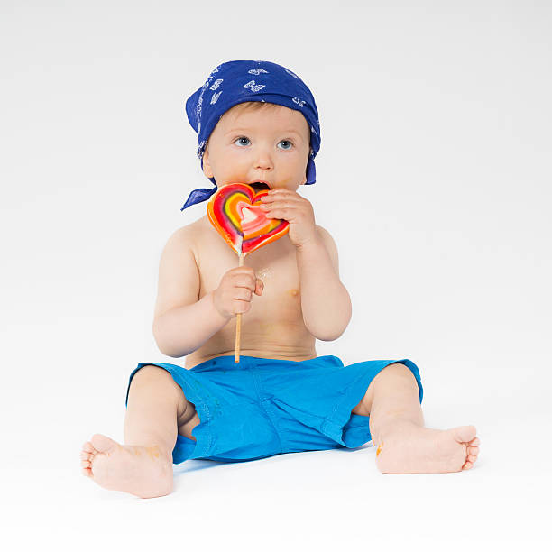 Sweet baby with colorful lollipop stock photo