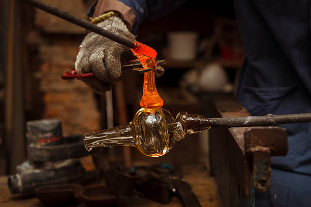 istock Glass Artist in her workshop making glassware 500000294