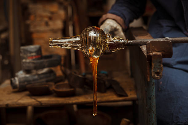 istock Glass Artist in her workshop making glassware 500000304