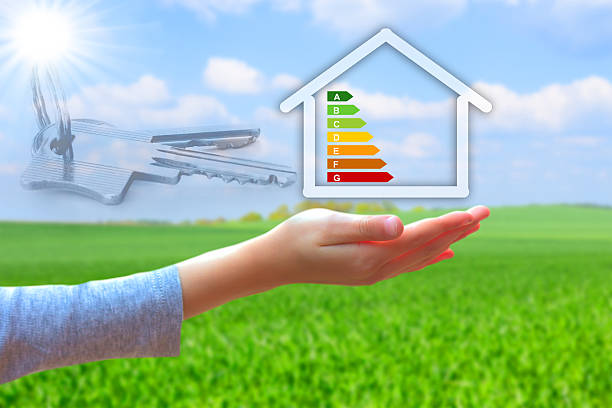 istock hands holding house with energy efficiency rating 500000817