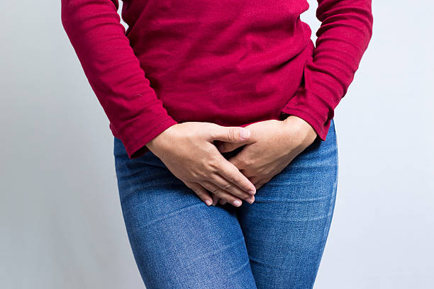 istock Woman with Hands Holding her Crotch 500002918