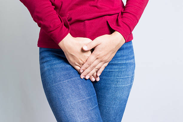 istock Woman with Hands Holding her Crotch 500002990