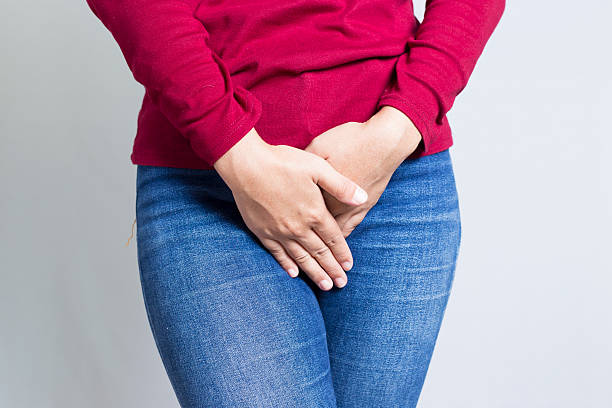 istock Woman with Hands Holding her Crotch 500003072