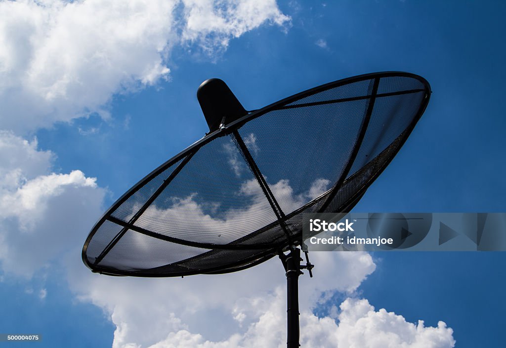 Satellite TV receiver SAtellite TV receiver on blue sky with cloud  background. Backgrounds Stock Photo