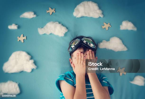 Boy Lying On Blanket With White Clouds Stock Photo - Download Image Now - Child, Eyes Closed, 2015