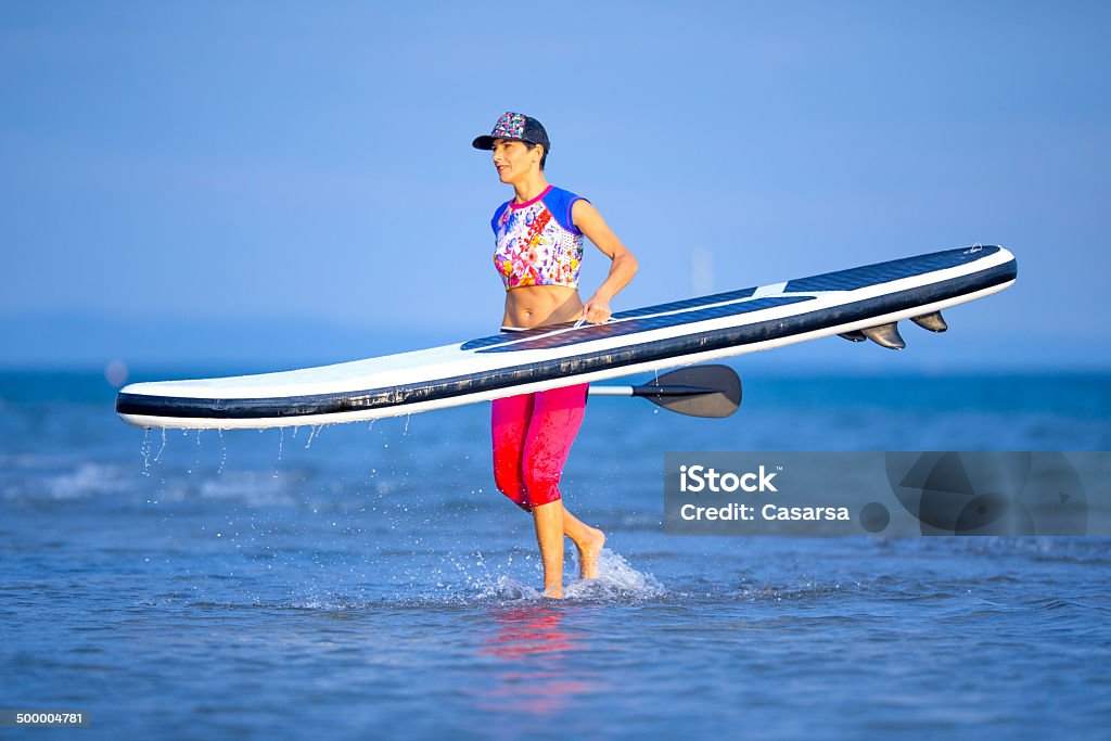 Paddling Woman padling Aquatic Sport Stock Photo