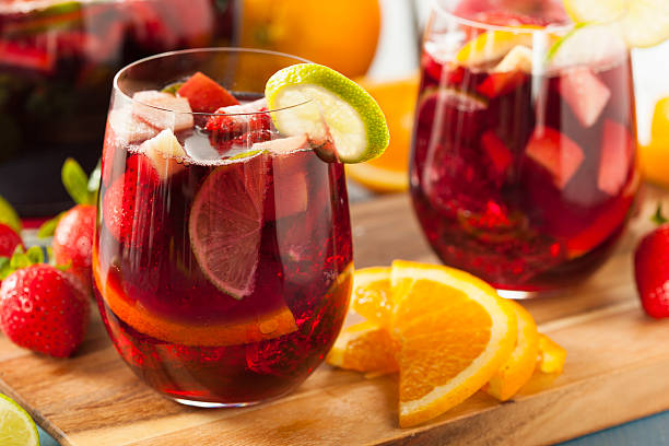 Homemade Delicious Red Sangria Homemade Delicious Red Sangria with Limes Oranges and Apples punch drink stock pictures, royalty-free photos & images