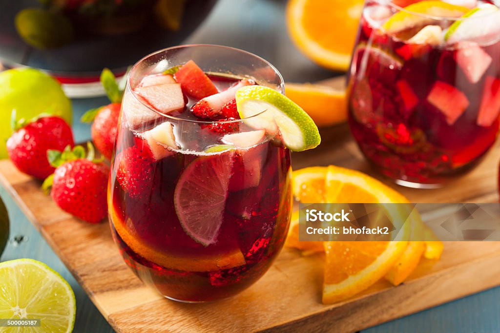 Homemade Delicious Red Sangria Homemade Delicious Red Sangria with Limes Oranges and Apples Alcohol - Drink Stock Photo