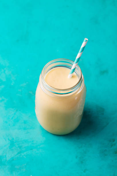 istock Mango Coconut smoothies in a glass jar 500006256