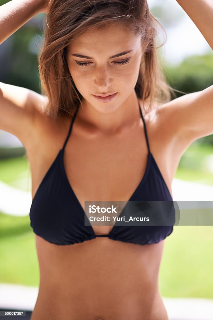 She pretends not to notice the jaws dropping around her Shot of a beautiful young girl in a bikinihttp://195.154.178.81/DATA/i_collage/pi/shoots/783502.jpg 20-24 Years Stock Photo