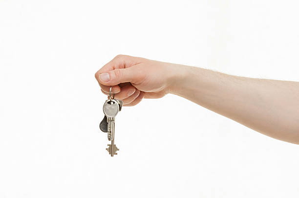 istock Man's hand holding a bunch of keys 500017646