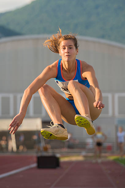 istock Young Women at Long Jump Competition 500018387