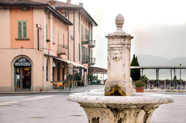 Pisogne, Italy - February 16, 2013: ancient fountain in the town center of Pisogne on the Iseo Lake shore