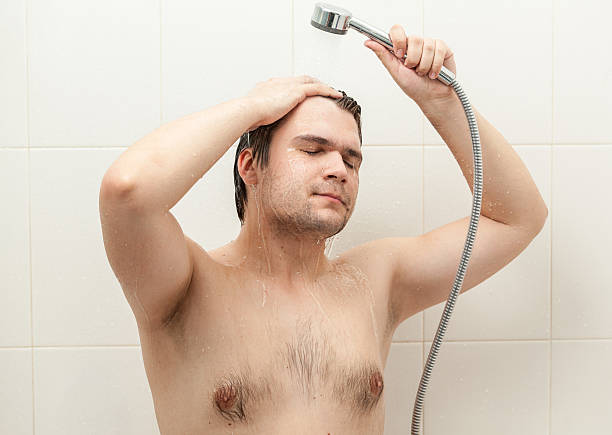 istock portrait of smiling man relaxing at douche 500018453
