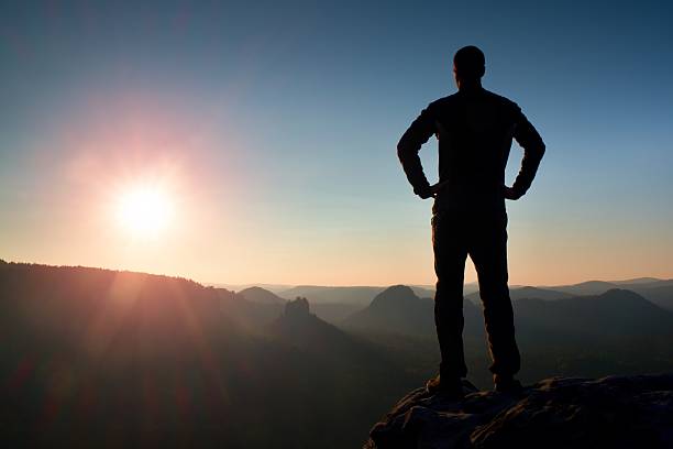 istock Silhouette of Confident and Man Standing with Hands on Hips, 500018512