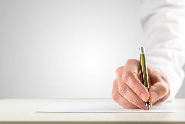 istock Hand holding a ballpoint in order to start writing 500019589